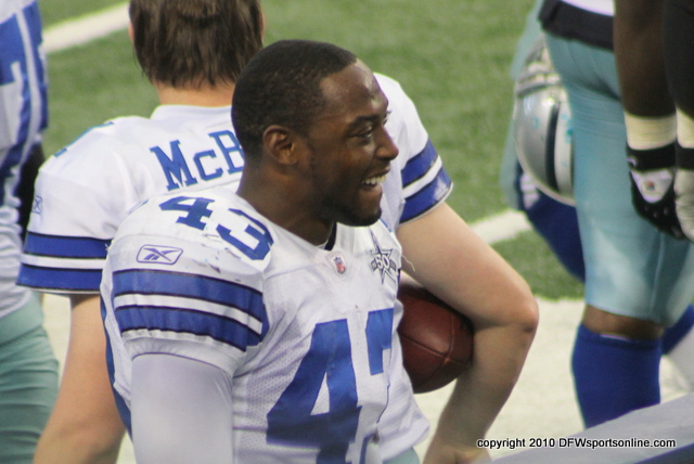 Gerald Sensabaugh laughing on the sideline in the final minute while his team is losing 35-17. Photo by George Walker